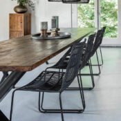 alt=“luxury stackable black rattan dining chair ”