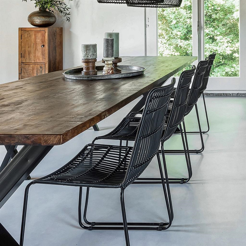 alt=“luxury stackable black rattan dining chair ”