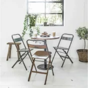 alt=“industrial vintage metal folding chairs”
