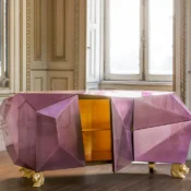 alt=Bespoke furniture makers in London - Smithers craftsman hand-finishing a custom dining table in our UK workshop"