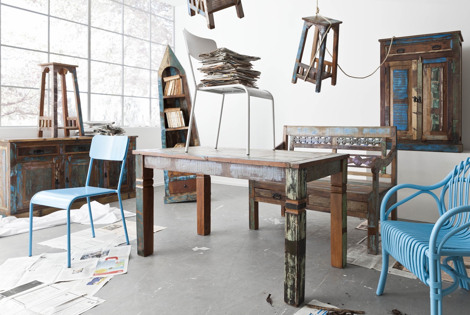 Reclaimed wood dining table collection featuring industrial, rustic and farmhouse styles, including round dining tables, reclaimed boat wood tables, industrial café tables and bespoke dining furniture by Smithers
